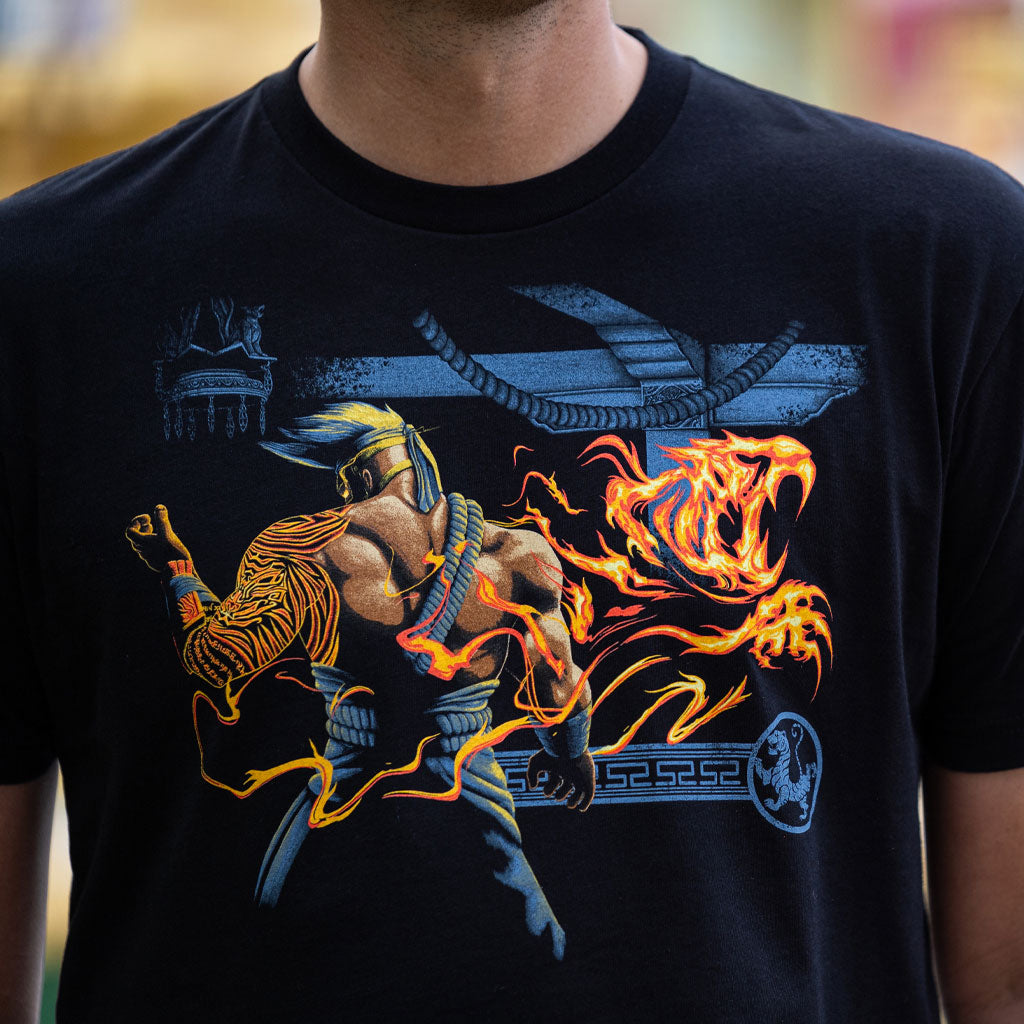 This photo is a closeup shot of the Jago t-shirt. It shows the focus of the shirt in crisp detail. 