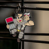 Skullgirls Beowulf keychain hanging from a cage like you would see at a wrestling match.